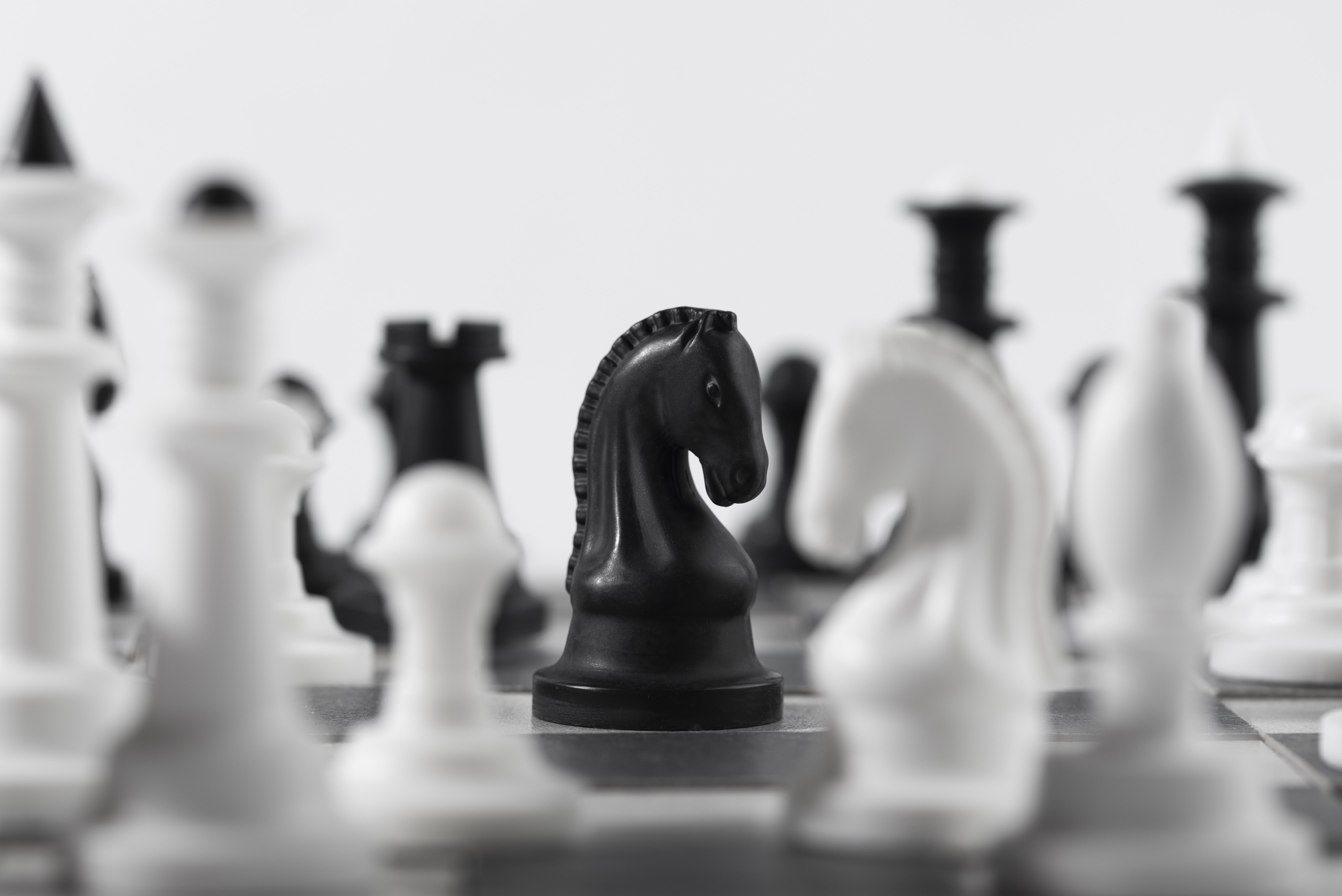 monochrome-chess-pieces-with-game-board